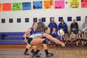 Upper left: In the game against Barnum Linden Sutton bumped a ball to her teammates with Sarah Carman looking on. Above: Maddy Roy playing in the front row, shows great effort in getting to this ball against Barnum. Left: Alex Slanga makes a great play to save a ball before it hits the floor.