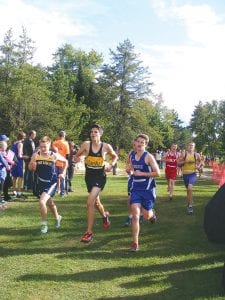 Running strong, Roman Schnobrich and a runner from Marshall pushed the pace together in the cross country race held at Eveleth.