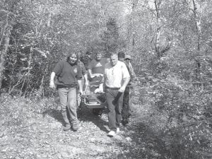 Working together, members of the Tofte First Responders squad, Cook County Ambulance and Cook County Search and Rescue carried an injured woman down the Carlton Peak hiking trail on Sunday, September 28.