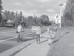 Students, parents and community members enjoyed walking to school together on September 3, the first “Walking School Bus” day this fall. These folks are on the “east route.” Everyone is invited to walk or bike to school on International Walk to School Day on Wednesday, October 8.