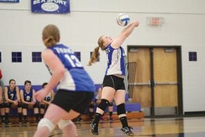 With Sarah Carman looking on, Maddy Roy makes a great play on the ball and bumps it to the front line in the Vikings' match against Lakeview Christian. The Vikings swept the Lions 3 games to 0.