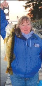 Above: Wendy Ford of Grand Marais recently traveled to St. Louis County for a weekend of fishing at Lake Kabetogoma. She caught this 25-inch walleye while fishing off the dock with a Beaver House beaver flick and a dead minnow. The big fish was released, but Wendy and her husband, James “Sporto” Ford caught some other nice eating sized walleyes.