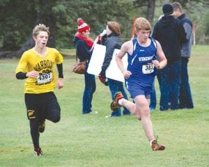 Above: Leif Anderson (No. 383) powered by this Warroad runner to help the Vikings’ junior high boys’ team finish in second place at Swain. Leif was the Vikings’ third runner on the junior high team. Left: Showing good form, Henry DeArruda-Weaver ran a strong race at Swain.