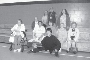 Elders enjoyed a Tai Chi demonstration. (L-R) Doris Blank, Delma Grandlouise, Judy Ranta, Vera Amyotte, Ellen Olsen. (L-R, back) Dottie Griffith, Hattie Pepion, Orlando Swader and Yafa Napadensky.