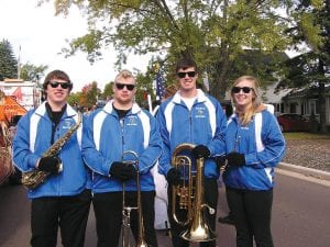 Left: Nick Wiegele, Noah Warren, Andy Farley and Jami Sjogren waiting at the parade start.