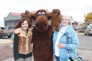 Leona Feeney of New Brighton, Minnesota (left) and Inez Foster of Crystal, Minnesota have come to Grand Marais to see Murray every year during Moose Madness. Leona said her friend is a “moose fanatic.” The women were headed up the Gunflint Trail the next day in hopes of seeing a real moose.