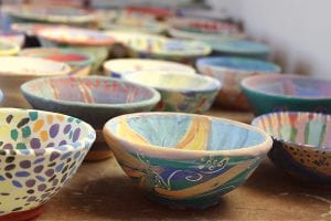 The bowls from the Paint-A-Bowl workshops at the Grand Marais Art Colony are ready to be filled with soup at the Empty Bowls event, a fundraiser for the Cook County Food Shelf.