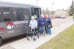 The polls in Grand Marais were busy on Election Day 2014. The Cook County courthouse was not only a polling place, but the Auditor’s Office was where all the last-minute mail ballots were dropped off. Friends visited as they came and went throughout the day. These friends got a ride to the polls on the Arrowhead Transit bus. (L-R) Harriet Walsh, Betty Larsen, driver Mark Quello, Sherrie Lindskog.