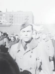 The 34th Infantry Division, marching down Superior Street to board a train for Camp Claiborne, Louisiana on February 1941. Front and center, a picture of determination is Willard Nelson of Lutsen.