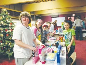 Eager workers with big smiles, the Bethlehem Lutheran Church Confirmation students helped last year with Operation Family Christmas.