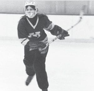 Grand Marais resident and noted figure skater Deb Mueller donned hockey skates recently to play in a 40th reunion game of the University of Minnesota Amazons. Mueller is pictured here in an early Amazon game.