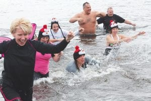 The Lake Superior Storm Festival on November 7-9 featured a variety of activities, ranging from workshops, storm-themed dining opportunities and a fashion show to the exciting Wave Dash at Lutsen Resort on Saturday, November 8. This year 57 “wave dashers” headed to the beach and put their toes in the water—or like these hardy folks—took a plunge into the waves. See more about the Storm Festival on page A3.