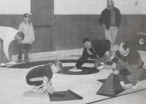 Curling club volunteers have done a lot of work at the Cook County Community Center through the years. Volunteers are pictured here putting the finishing touches on a “house” to prepare the rink in the 1999-2000 season.