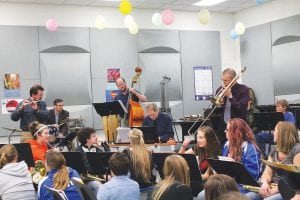 The Sky Blue Jazz Ensemble performed and practiced with the Cook County High School Band in October introducing students to the history and fundamentals of jazz. Left: Ensemble members are (L-R) Erik Hahn, Mike Roth, Mike DeBevec, Brett Jones, Al Anderson. Their love of jazz is apparent.