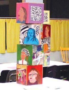 The 5th-6th graders covered six sides of a cube with artwork that expresses their personalities. The cubes even had QR codes that enable people with smart phones to scan and see a student’s recorded message.