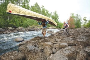 During their 100 day “Paddle to D.C.” Dave and Amy Freeman encountered long stretches of beautiful water and long hard portages like the one above. Here Dave carries their “petition,” the Wenonah canoe that more than 10,000 people signed which was the primary vessel that carried them as they wound through the Boundary Waters Canoe Area Wilderness into Canada and then New York and on to Washington D.C.