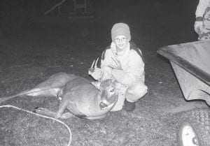 Above: Adam Dorr of Grand Marais shot his first buck on opening day of hunting season 2014 at 4:20 p.m. He was hunting from his Grandpa Dick Dorr’s stand. The nice buck has an 8-point rack.