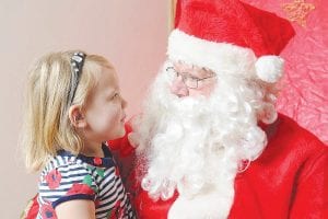 This sweet young lady is having a serious conversation with Santa Claus at the Cook County Girl Scout’s Santa’s Workshop on Saturday, December 6. See more of the Christmas fun on page A3 and read letters to Santa on page A2.