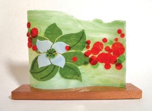 Artists are encouraged to ignite their imagination and illuminate the ordinary, as Nancy Seaton has done with this exquisite fused glass bunchberry.