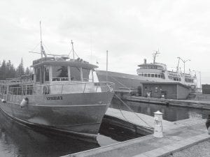 The National Park Service has been experimenting with methods of treating ballast water to prevent the spread of aquatic invasive species. The National Park Service Ranger III, pictured alongside the Voyageur II at Rock Harbor, Isle Royale, has been the research vessel for this study. Initial tests showed the ballast treatment systems employed were successful.