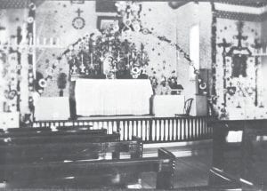 The sanctuary of the Saint Francis Xavier Catholic Church, the “Chippewa City Church” was festive in this Christmas photo taken in the 1890s. The church was built by Ojibwe carpenter Frank Wiskop and served as the only Catholic church in Grand Marais from 1895-1916. The final mass was conducted there on Christmas 1936. The lovely church was placed on the National Register of Historic Places in 1985 and work to restore the building had been done, thanks to generous donations from the Grand Marais Lions Club, the Catholic Church, the Grand Portage Band of Lake Superior Chippewa and the Minnesota Historical Society. Efforts to continue to preserve the historic piece of the past continue. If you would like to learn more about the church, or donate to its ongoing restoration, contact the Cook County Historical Society at (218) 387-2883.