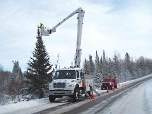 With help from Aaron Sjogren and Brian Schroeder of Arrowhead Electric and Jim Morrison and Dave Tuttle of the Gunflint Trail Volunteer Fire Department, the festive folks on Birch Lake once again lit up their “thousand points of light” Christmas tree on the Gunflint Trail.