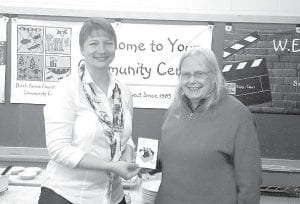 Over 140 Birch Grove visitors and friends took surveys, volunteered and attended events making them eligible to win a drawing for a $100 Visa gift card. Birch Grove Foundation Director Caroline Wood presents the prize to Pam McDougall.