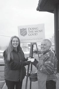 Right: Anne Sullivan of the American Legion Auxiliary recently presented Mary Sanders of the Salvation Army with a check for $500. Sanders, a dedicated Red Kettle bell ringer, said the gift was deeply appreciated.