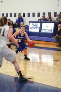 On this play, eighth-grade guard Sophie Eliasen (31) looks for an open Viking to pass to. Eliasen, a tough defender, is one of the quickest Viking varsity players and is seeing more and more playing time as the season unfolds.