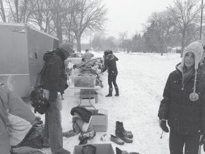 Volunteers with the Help-A-Vet program were pleased to distribute cold weather clothing collected by American Legion Post 413 Auxiliary. Inset: Cook County’s response to the request was fantastic.