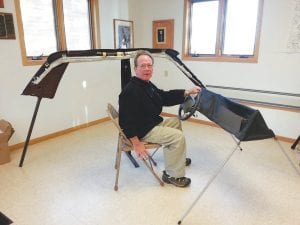 Local fire departments received vital training on responding to vehicle crashes involving hybrid cars. Instructor Butch Lysholm talks about the location of air bags and electronics in this mock-up auto.