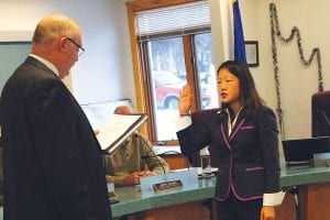 Assistant County Attorney Jeanne Monson takes the oath of office. Monson has been the acting assistant county attorney since October 2013.