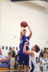 Andy Farley went up high on this jump shot to score two of his 15 points against the Silver Bay Mariners. The Vikings lost a hard fought contest 62-57.