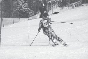 Cook County racers traveled to Mont Du Lac on January 19 for the Denfeld Invite. Left: Jack Viren battles the race course. He suffered a minor concussion at the Denfeld invite. Above: Morgan Weyrens-Welch prepares for her next turn.