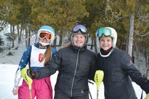 Although the weather forecast called for freezing drizzle, the skies cleared and conditions were good for the Moose Mountain Invite at Lutsen Mountains on Friday, January 23. Above left: Reilly Wahlers, Madysen McKeever and Hanna Borson enjoy the beautiful day on Moose Mountain. Above: Sophomore Logan Backstrom won second place at the Moose Mountain Invite. Left: Erik Lawler made all the right moves, taking the bronze.