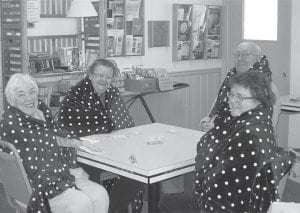 Anyone who rides the Senior Center bus on trips will look cute and cozy in these new blankets. Happy to show off the polka dots were (L-R) Gladys Anderson, Director Bev Green, Tom Hedstrom, Renette Pearse.