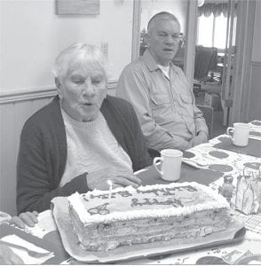 Above: Betty Wilson blows out the candle on her cake at her 90th birthday celebration at the Senior Center. Left: Probably the cutest guest to ever visit the Senior Center, Poochie, the “almost” Senior Center dog.