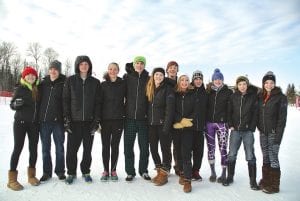 Above: The Alpine Vikings’ Section team. (L-R) Reilly Wahlers, Logan Backstrom, Damian Zimmer, Alyssa Martinson, Will Lamb, Ava McMillan, Erik Lawler, Morgan Weyrens-Welch, Ezra Lunde, Sela Backstrom, Will Surbaugh, Haley Yoki. Far left: Senior Co-Captain Ava McMillan skis the last run of her high school career. Left: Sophomore Will Lamb rips a turn in his second run at Sections, landing a 4th place finish!