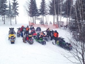 A great time was had by all at the Cook County Ridge Riders Snowmobile Club Fun Run. Some people took their vehicles while most traveled by snowmobile trails to six stops, where cards were handed out for a traveling poker game. The stops included Gunflint Lodge, Gunflint Pines, Windigo Lodge, Trail Center, Hungry Jack Lodge and Devil Track Landing. About 150 riders took part in the sixth annul fundraiser held Saturday, February 7. Lower left: The weather cooperated and fresh snow greeted riders at every stop, as it did at Devil Track Landing.