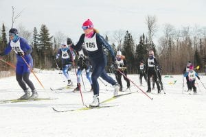 Leading the pack in the mass start at the Pincushion Winter Festival were former Grand Marais resident Nancy Rova (No. 183) and Kerrie Berg (No. 165) of Grand Marais. Berg finished the women’s 18K Skiathlon in 2nd place, the top finish for local women. They were all smiles.