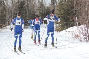 The top three finishers in the Pincushion Winter Festival 18K Skiathlon speed into the arena. (L-R) Julian Smith (3rd), Sam Greer (2nd) and first-place finisher David Askwith. The event included the skiathlon and classic and freestyle races for kids and adults on Sunday, February 15. There were also skijoring races. See more of the winter festival on page A3.