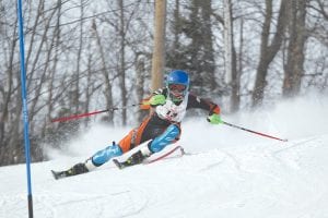 Above: Will Lamb pushes his way to a top 10 finish at State. Lamb not only made it to the top 10, he was the top finisher for the Northland boys. Left: Logan Backstrom’s first run at the State Meet. He had two stellar runs and finished in an impressive 26th place.