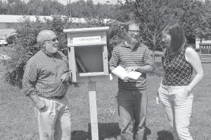 One of the projects selected for funding in last year’s Great Place Project was this Little Free Library on West 5th Street in Grand Marais. Checking it out are (L-R) Cook County Chamber Director Jim Boyd, Jay Arrowsmith DeCoux (who built the little free library) and Moving Matters Coordinator Maren Webb.