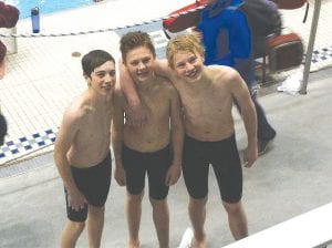 Cook County Community YMCA swimmers had a great time at the State swim meet on February 8. Celebrating after their swims were (L-R) Will Surbaugh, Henry DeArruda-Weaver, and Ole Sorenson.