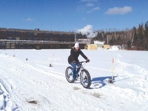 Fat tire bike vendors were on hand with bikes for demonstration rides. Rhonda Harrison of Easter Seals takes a bike out for a spin.