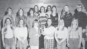 Proudly displaying their District Championship trophy are the members of the Cook County High School girls’ gymnastics team. The roster includes, from front row left, Jill Anderson, Terry Zickrick, Manager Melody Martin, Donna Beckwith, Ann Simons and Cindy Netland; in second row are Coach Margaret Rasmussen, Jennifer Vervoort, Lori Nelson, Janie Schmidt, Linda Jurek, Ann Bushman, Sandy Suck, Nancy Nelms and Coach Donna Helmerson. Not pictured in this March 28, 1974 photo are team members Carah Thomas and Carline Sjoberg.