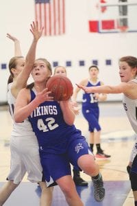 Emily Jacobsen has been a terror for the Vikings, playing in close to the hoop. Here she goes up for 2 points against the South Ridge Panthers. The 6-foot sophomore scored 25 points and pulled down 10 rebounds in that game, and did even better against the Lakeview Christian Academy team in a game the Vikings won 45-35.