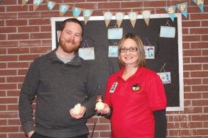 In cozy offices between the high school and elementary libraries, school counselors are available with a number of social and emotional health offerings. Career and Guidance Counselor Kris Hoffman and School Social Worker Anna Sandstrom—pictured here with funky stress balls, one of the tools used to calm anxious students—gave a report to the school board on the services they offer.