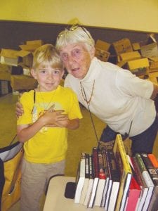 Kids of all ages enjoy a book sale, like these folks at the Fisherman’s Picnic event. Library Friends is hosting a special midwinter gardening book sale on March 21.