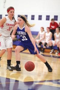 Eighth-grade guard Sophie Eliasen scored a career-best 15 points against Nashwauk in the Vikings’ last game of the season. Here she is in action against Cromwell, using her leg speed to blow past the Cardinal defender.